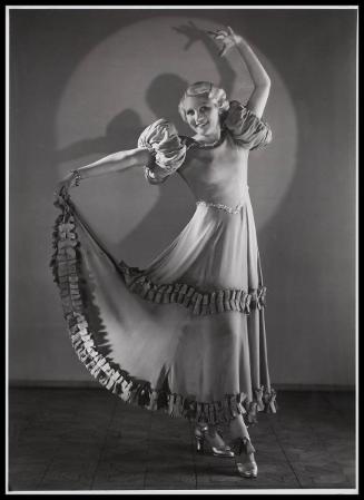 Woman modelling a flamenco style dress.