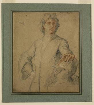 Young Man Standing with his Hand on a Helmet