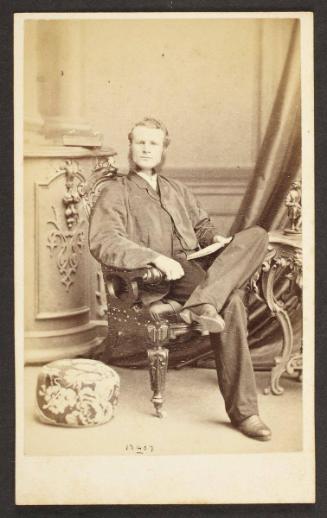 Unknown sitter [portrait of a seated man with a open book]