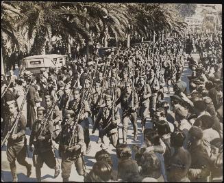 Anto-Red troops pouring into Malaga after Franco's army had liberated the city from its reign of red terror.