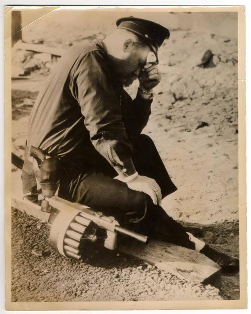 Tired Cop. A Policemen on Duty at the Goddyear Tyre [sic] and Rubber Company's Works at Akron Ohio, where Recent Rioting Injured 80 People…