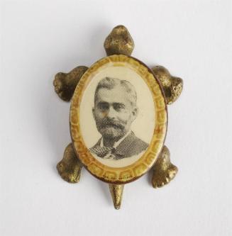 [Turtle paper weight with portrait of a man]