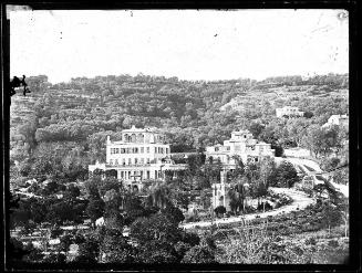 [View of villas on a wooded hillside in Cannes]