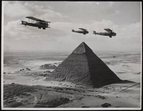 Ancient and Modern. 'Valentia' bombers flying over the Pyramids near Cairo on their way with urgent supplies to quell the riots in Palestine.