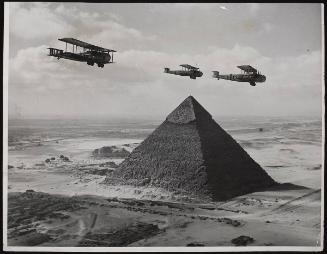 Ancient and Modern. 'Valentia' bombers flying over the Pyramids near Cairo on their way with urgent supplies to quell the riots in Palestine.