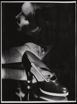 Shoe, model in background.