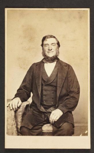 Unknown sitter [portrait of a seated man with his right hand on side table]