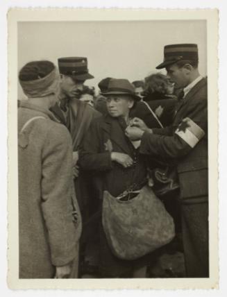 Ghetto resident being tagged by ghetto police for deportation