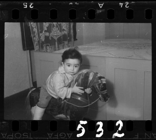 Portrait of a young child on a rocking horse