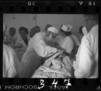 Doctors performing surgery on baby