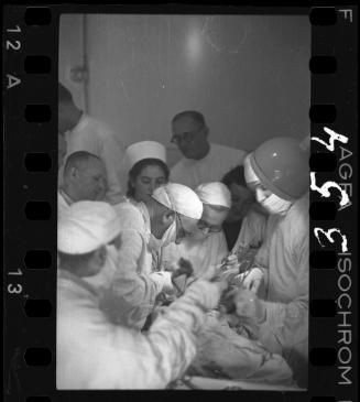 Doctors performing surgery on baby