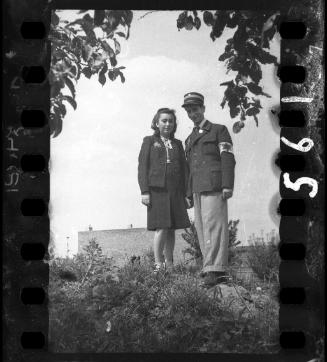 Jewish policeman and his wife holding hands