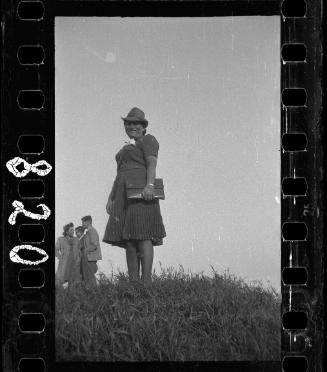Woman posing in a hat