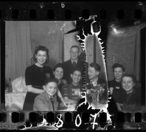 The bride and groom celebrating with family and friends at their wedding in the ghetto