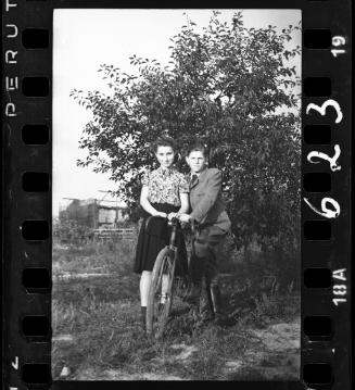 Young boy and a girl on a bike