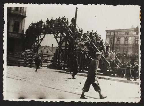 Lodz residents crossing the Zigerska Street bridge