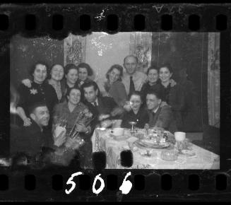 Residents at a dinner party in the ghetto