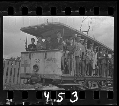 Workers of the Transport Department riding tram #52