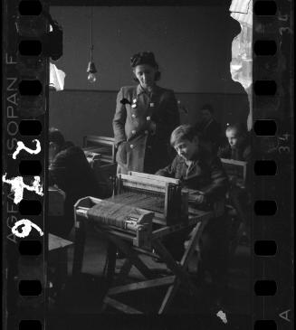 Children learning to weave with Mrs. M. Bronowska