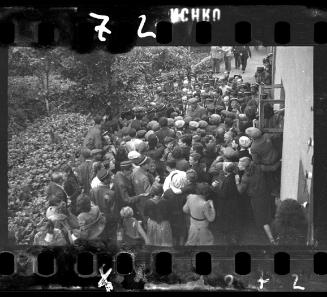 Mordechai Chaim Rumkowksi, "Elder of the Jews" and Chairman of the Judenrat, surrounded by large crowd of ghetto police and residents