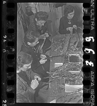 Women plaiting decorative bands in a workshop ("ressort") in the ghetto