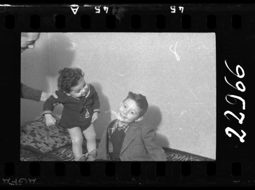 Portrait of a boy with a baby