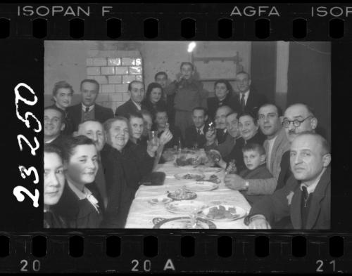 Large group of residents sitting around a dinner table