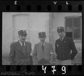 Three Jewish policeman standing in the ghetto