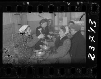 Workers and residents in the kitchen