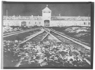 Distant view onto a train depot with empty pails in the foreground