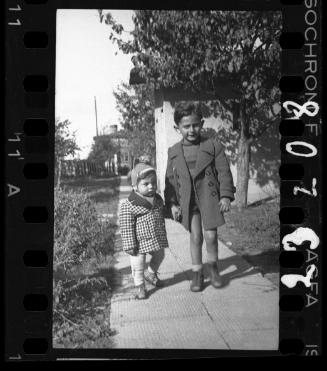 Portrait of a young boy and a child