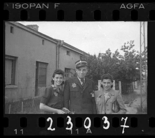 A Jewish policeman and two women in the ghetto