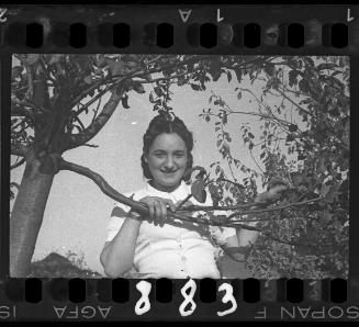 Portrait of a young woman in the trees