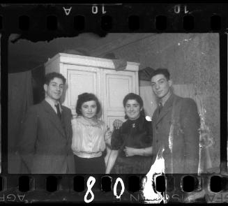 Two young couples at a wedding in the ghetto