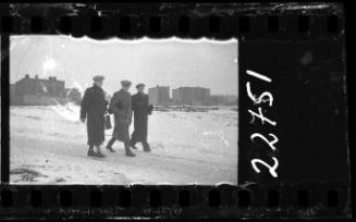 Residents walking down the street in winter