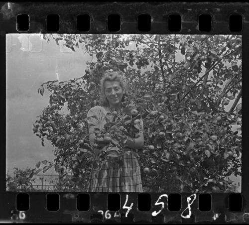 Portrait of Stefania Schoenberg holding an apple tree branch
