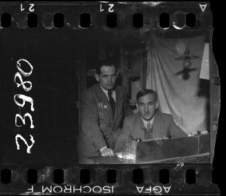 Two members of the ghetto administration at a desk