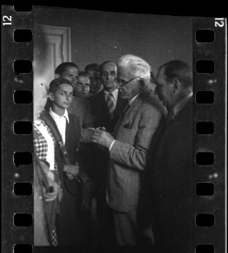 Mordechai Chaim Rumkowksi, "Elder of the Jews" and Chairman of the Judenrat, speaking to a group of youth and administrators