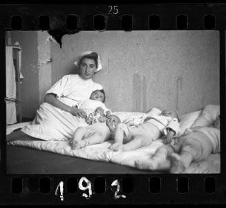 (Nurse, Toni Rotkopf), in the hospital nursery