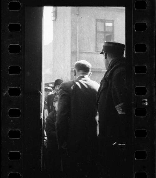 A Jewish policeman and an unidentified man standing in a doorway