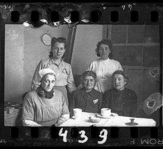 Nurse and hospital staff of the Kolonia Children's Hospital in Marysin, sitting at a table