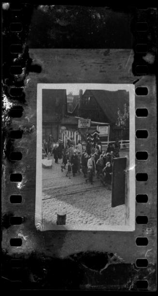 Deportation group walking across train tracks