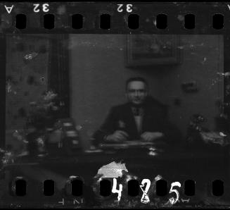 Administrator sitting at his desk