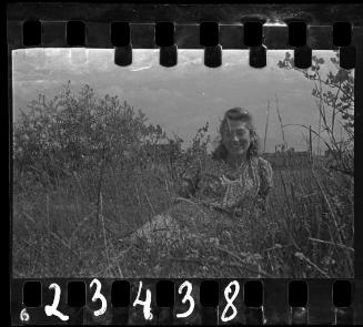 Portrait of Stefania Schoenberg sitting in the grass