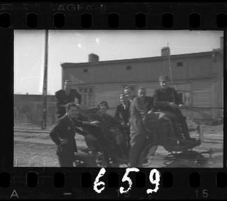 Group of residents posing in a carriage in the ghetto