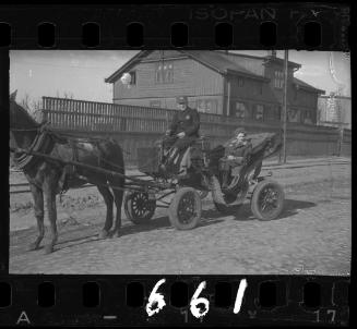 Woman riding in a carriage in the ghetto