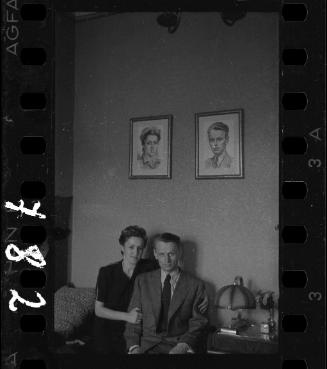 A ghetto couple with their portraits