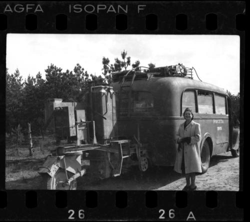 Woman posing with a mail truck