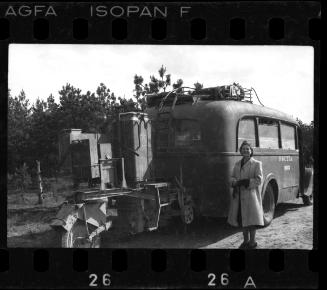Woman posing with a mail truck