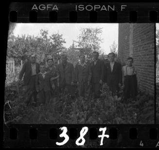 Residents standing in a vegetable garden in the ghetto
